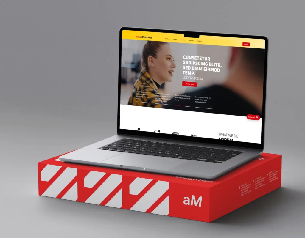 A laptop displaying a website with the header "DHL Consulting" is positioned on a red box with white diagonal stripes and the letters "aM." The website design shows a woman in a yellow and black plaid shirt, and text placeholders like "CONSECTETUR SADIPSCING ELITR, SED DIAM EIRMOD TEMP." The webpage also includes menu options and a red "Let's talk" button.