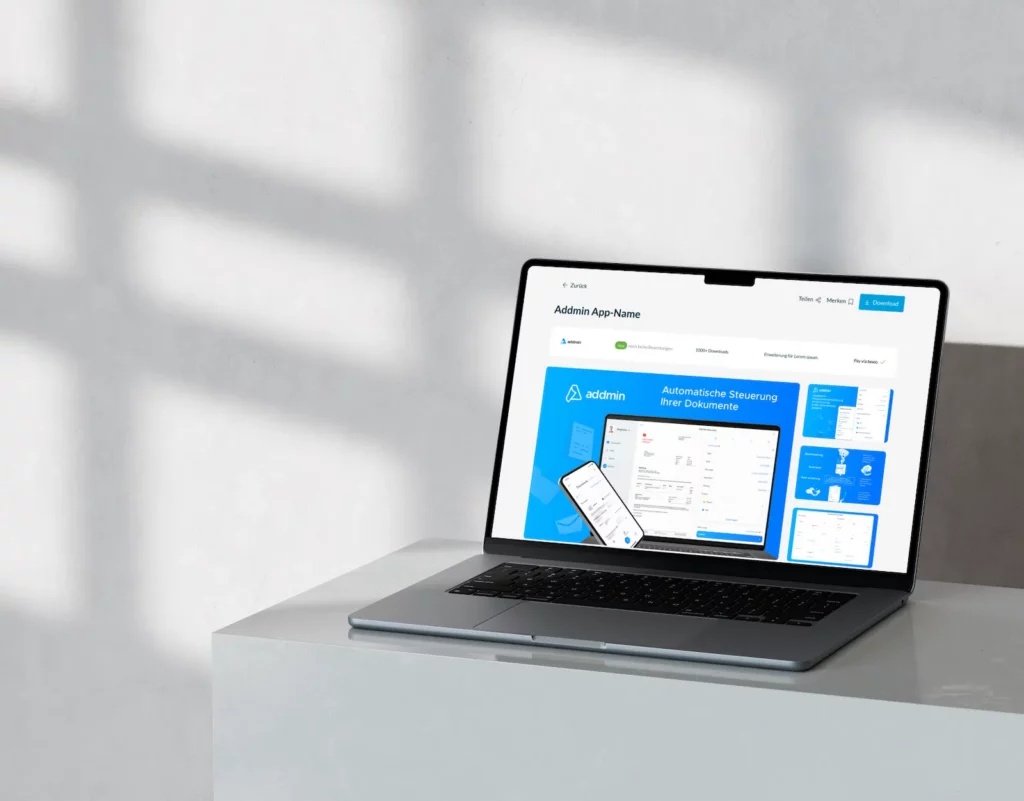 A laptop displaying a bexio website design on its screen, positioned on a concrete table with soft shadows in the background. The interface features a blue and white theme, showcasing document management tools and a mobile app preview.